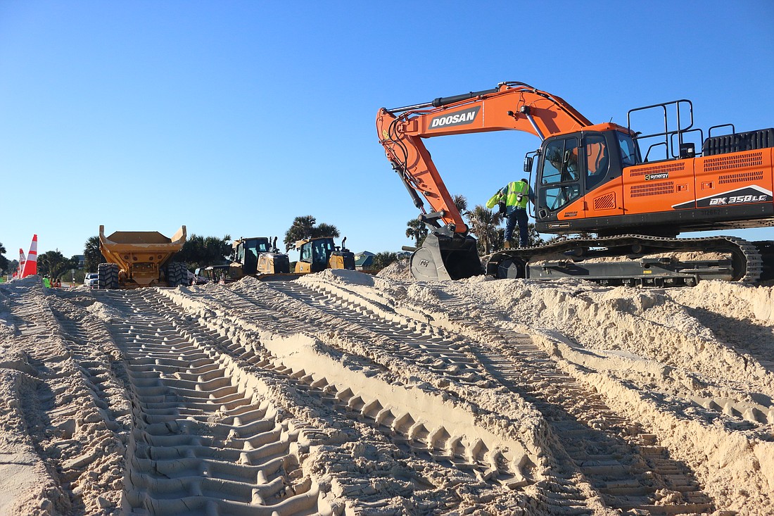Construction work on the MalaCompra Park dunes.