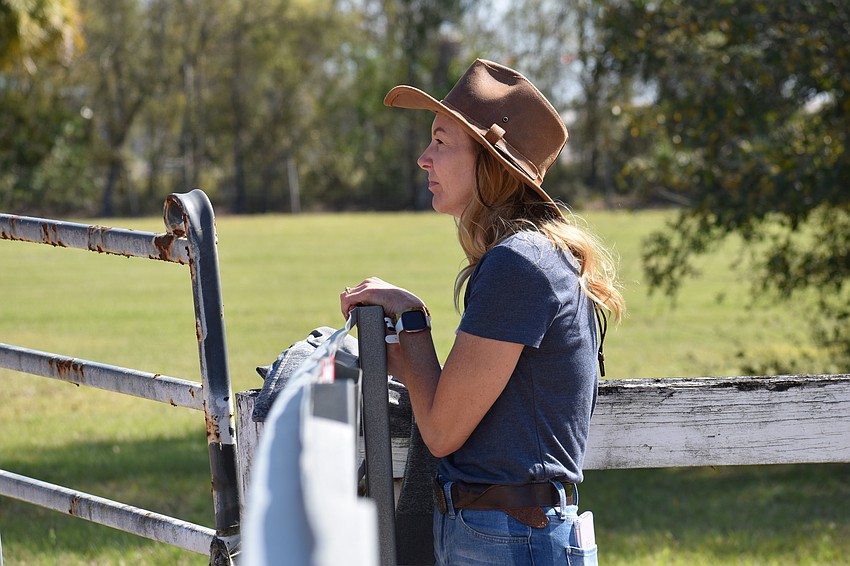 Myakka City's Jennifer Urban, an event volunteer, watches the competition.