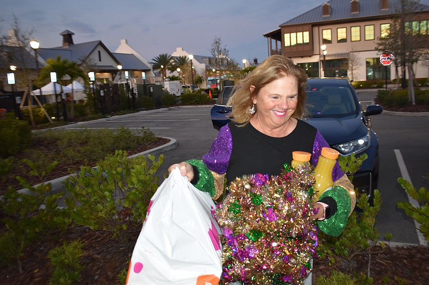 Run for the Beads Event Chair Annemarie Neubecker is all smiles as she arrives with props for the Run for the Beads.