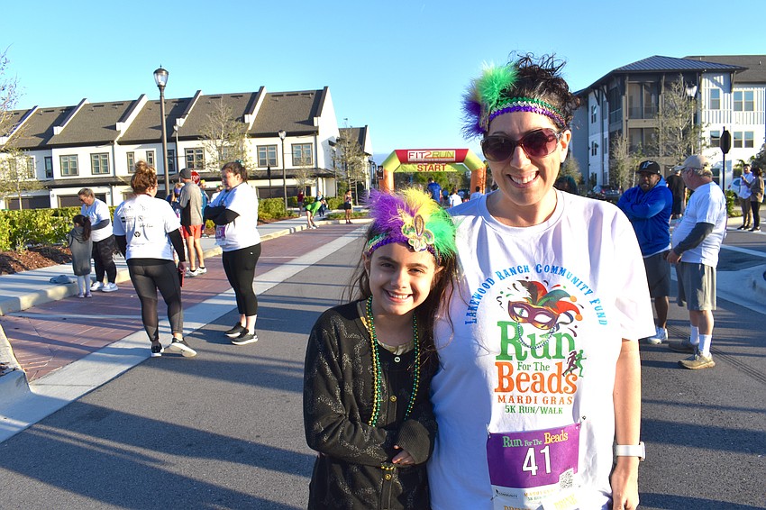 Sofia and Andrea Jackson of Sarasota are all smiles before the Run for the Beads at Waterside Place.