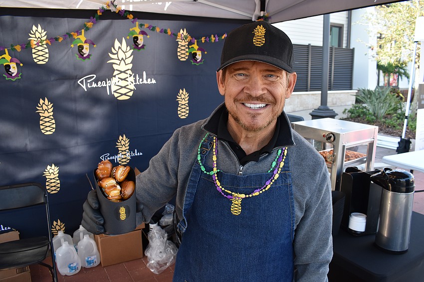 Mike Schenk of Pineapple Kitchen of Bradenton expects a big day at the Run for the Beads. He was selling the signature pretzels. 
