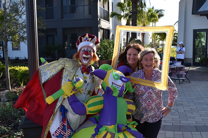 Chuck Sidlow knows how to frame an occasion as he entertains Sarasota's Sandra Albrecht and Jennifer Loose, both of RoseBay Realty.