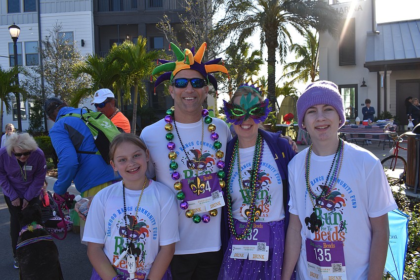 Sophie Lowrance, Jason Miller, Amy Lowrance and Jack Lowrance show off their beads.