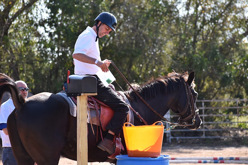 Sarasota's 52-year-old Dennis Dalstrom fetches some mail as part of the competition.