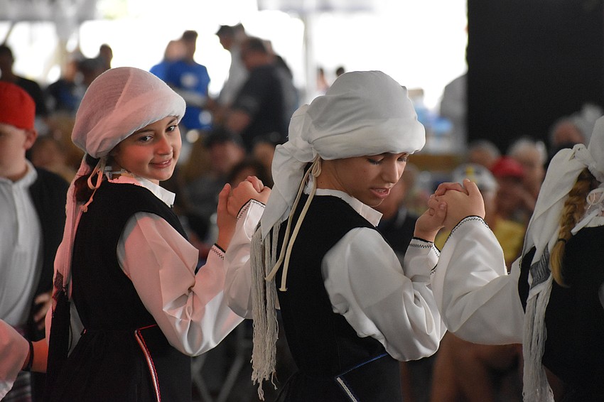 Emilia Nicolaides and Gabriella Youngblood dance at the event.