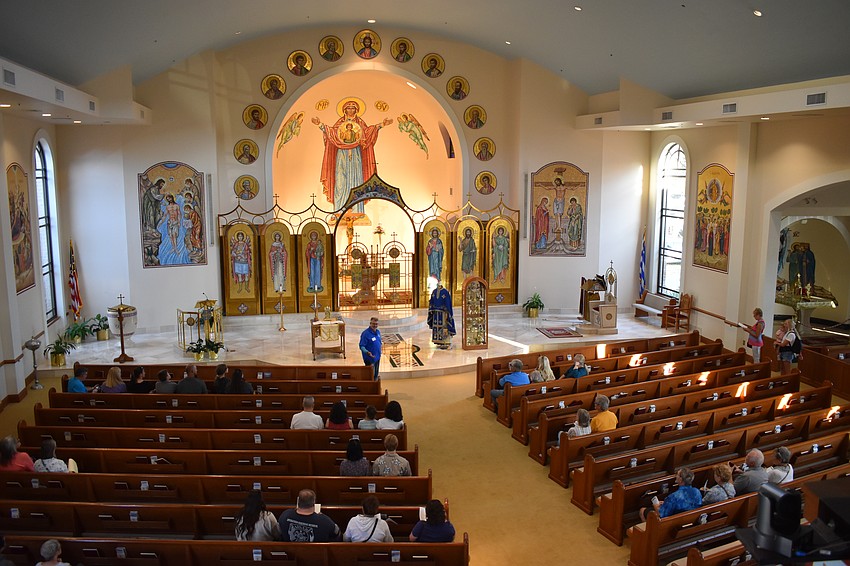 Dave Troyer offers a church tour to visitors.