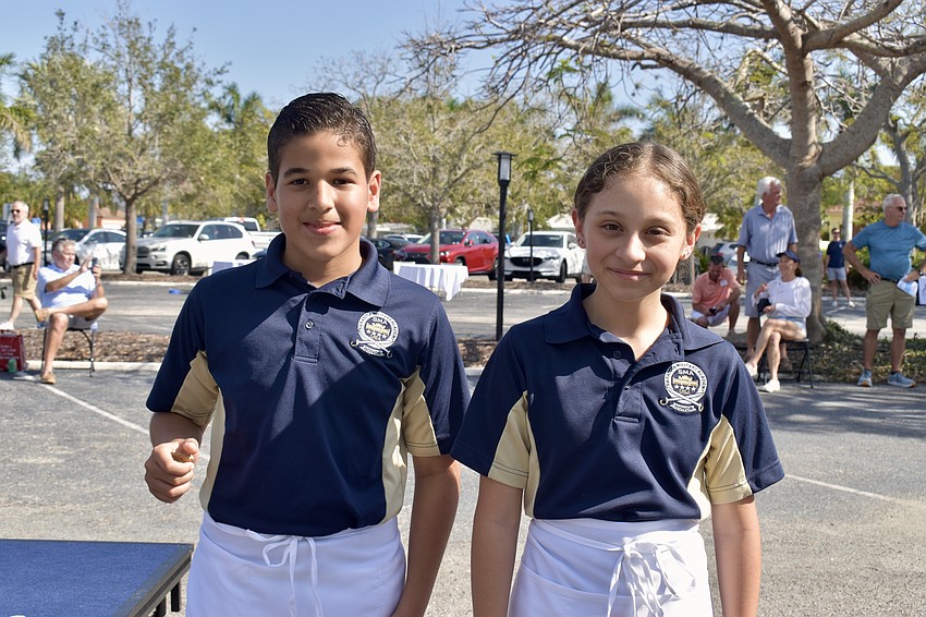 Sarasota Military Academy Prep students Pedro Silva and Krystal Niblett volunteer to help with the show.
