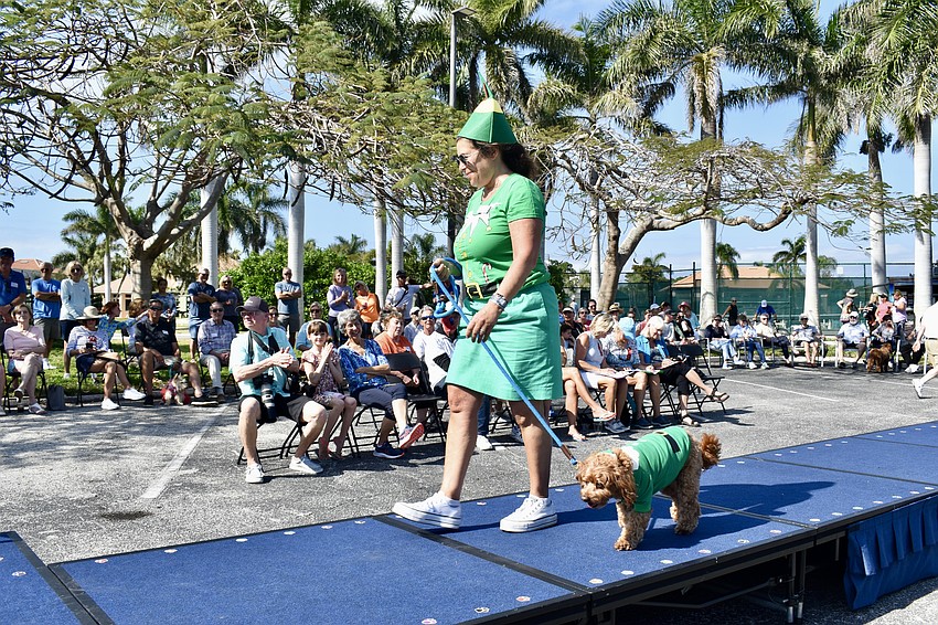 Leslie Breck and Buddy dress as elves for the show.
