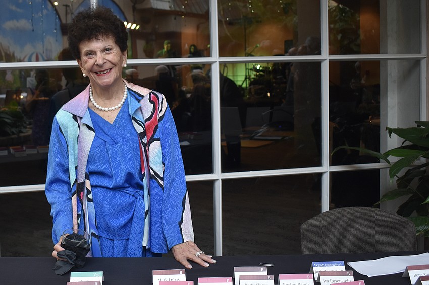 Barbara Pressman checks in guests.