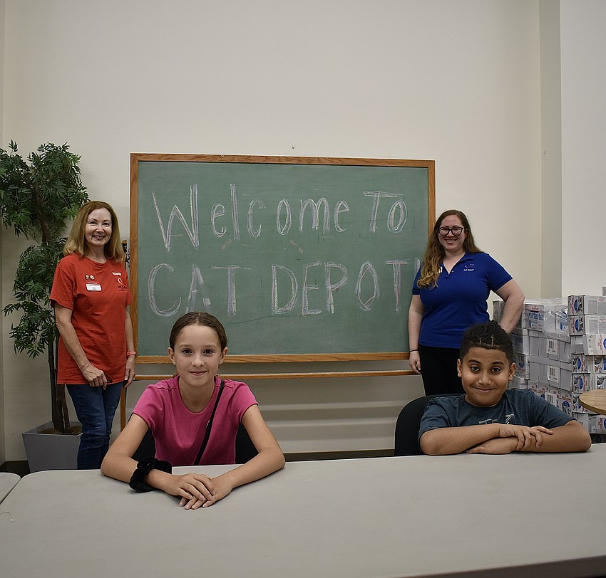 Cat Depot volunteer Louann Laybourn, Mairead Reardon, Blake Brown and Cat Depot Humane Educator Ellie Levine welcome kids to Cat University.