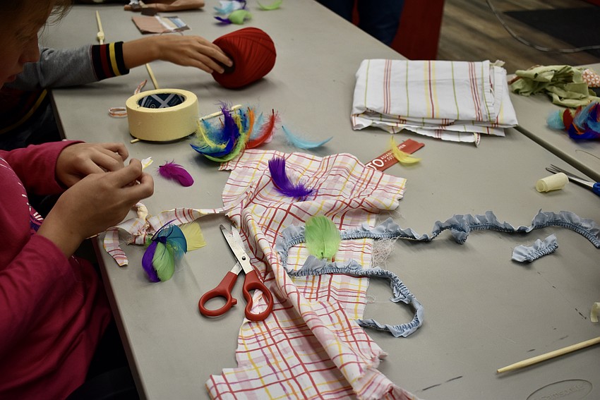 Kids get crafty with making their handmade cat toys.