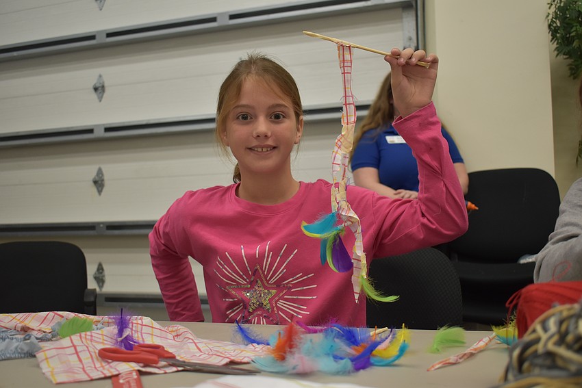 Sarah Pansey showsoff her finished cat toy.