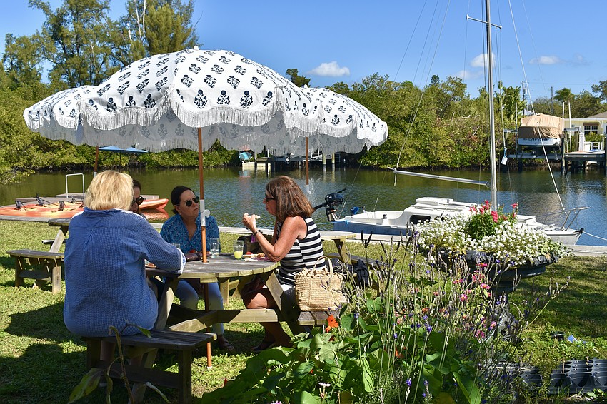 The class tastes the food and enjoy the garden.