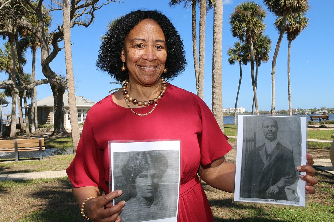 Belinda Davis holds photos of her great great-grandparents, Laura and William Amos Rose, at Ames Park. Photo by Jarleene Almenas