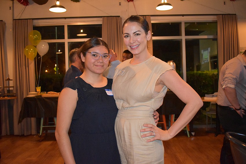 Naomi Gomez and Katy McBrayer-Lynch of Teen Court take the Non-Profit of the Year Award.