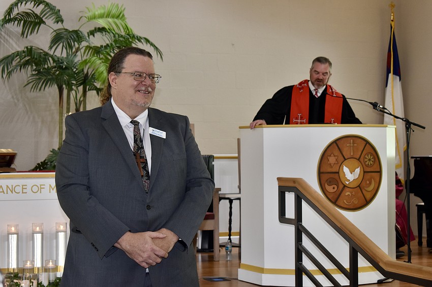 Jeffrey Nunes is commissioned as a pastor by Rev. Brock Patterson on Tuesday.