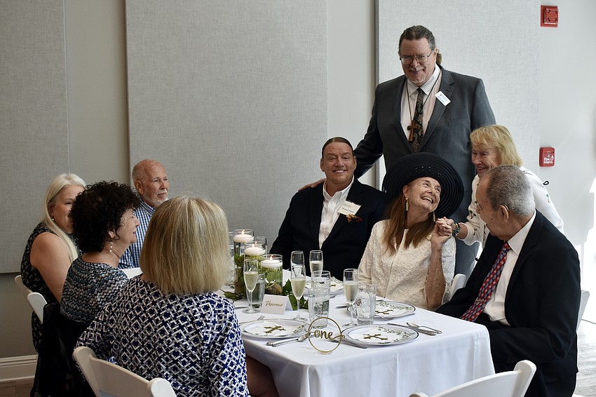 Friends and family celebrate the commission of Jeffrey Nunes as a pastor at the Longboat Island Chapel.