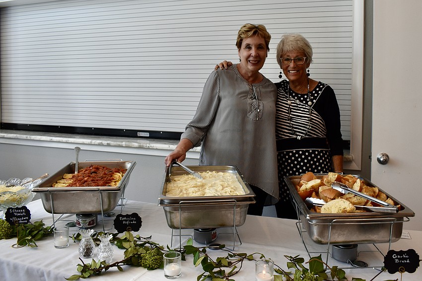 Karen Pashkow and Connie DiMaggio serve the sides.