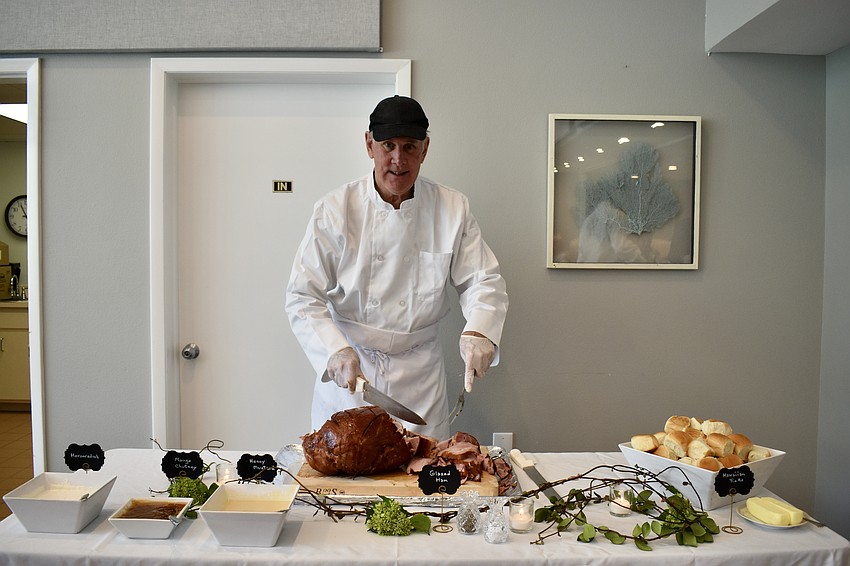 Chef David Stone carves the ham.