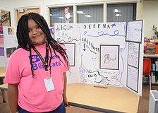 Third grader Jayla Fields shows off her project on Serena Williams. "It was fun learning she was the face of women's tennis," Fields says.