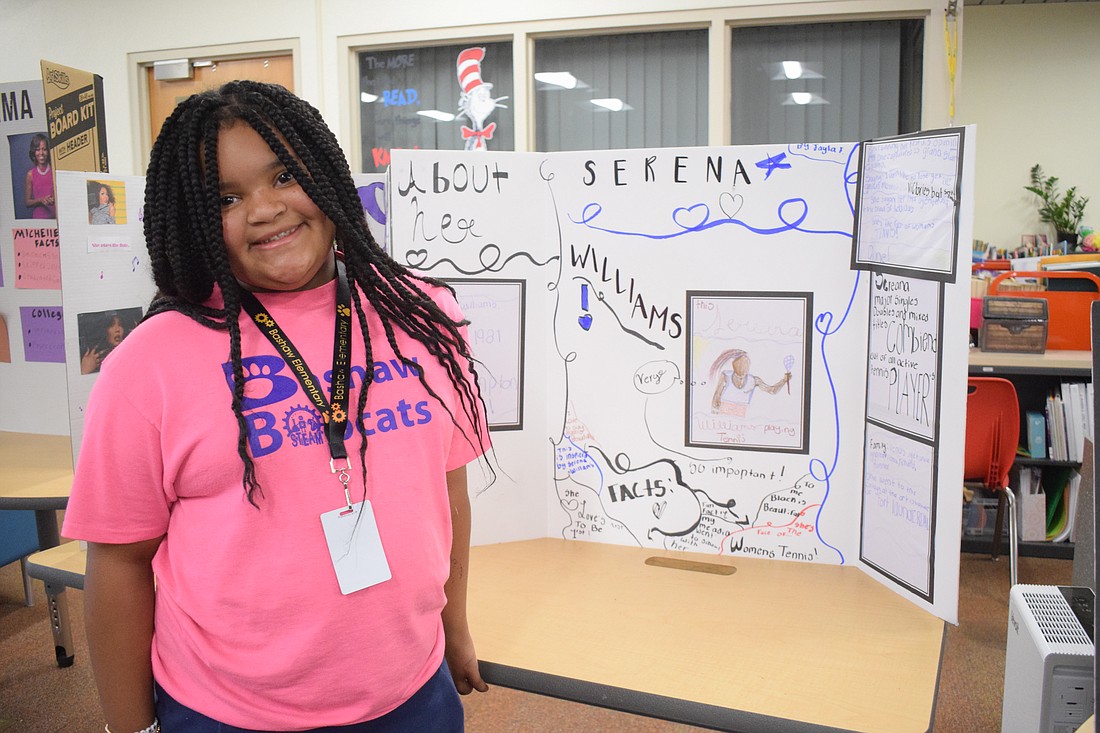 Third grader Jayla Fields shows off her project on Serena Williams. "It was fun learning she was the face of women's tennis," Fields says.