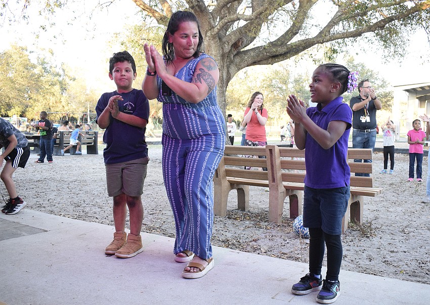 Third grader Liam Gil dances to the 