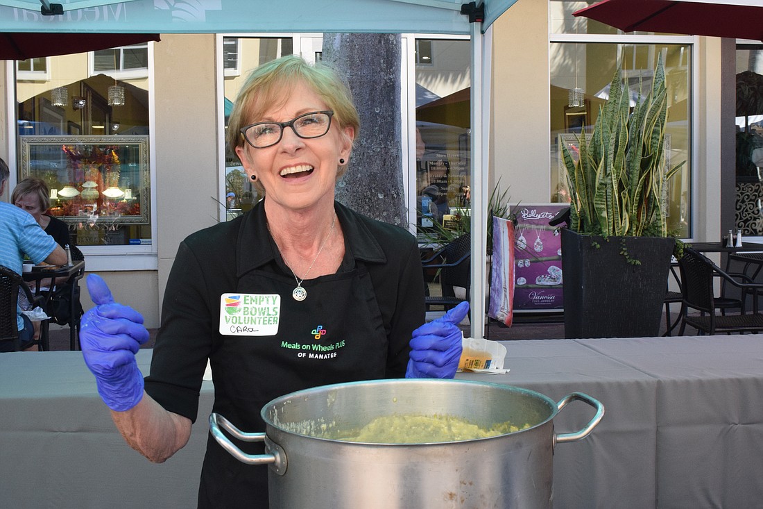 Lakewood Ranch's Carol Edwards dances between serving bowls of soup during Meals on Wheels Plus of Manatee's Empty Bowls. Volunteers for the nonprofit dedicated more than 23,000 hours to Meals on Wheels Plus of Manatee in 2022.