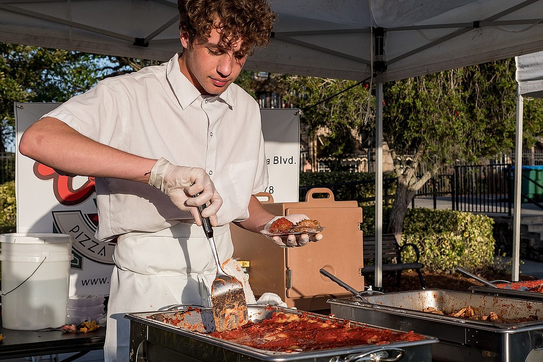 Peter Wilkinson, with My Cousin Vinny's, serves food during Taste of Ormond 2022. File photo by Kyla Sabate