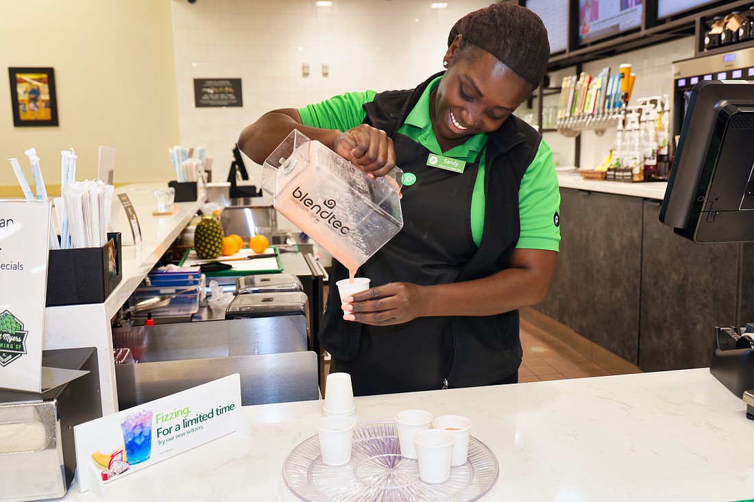 Sandy Pierre works in the Publix Pours at a Naples location on a recent morning.