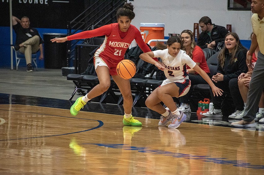 Cardinal Mooney girls basketball junior Kali Barrett (21) is the Cougars' leading scorer at 12.8 points per game as of Dec. 15.