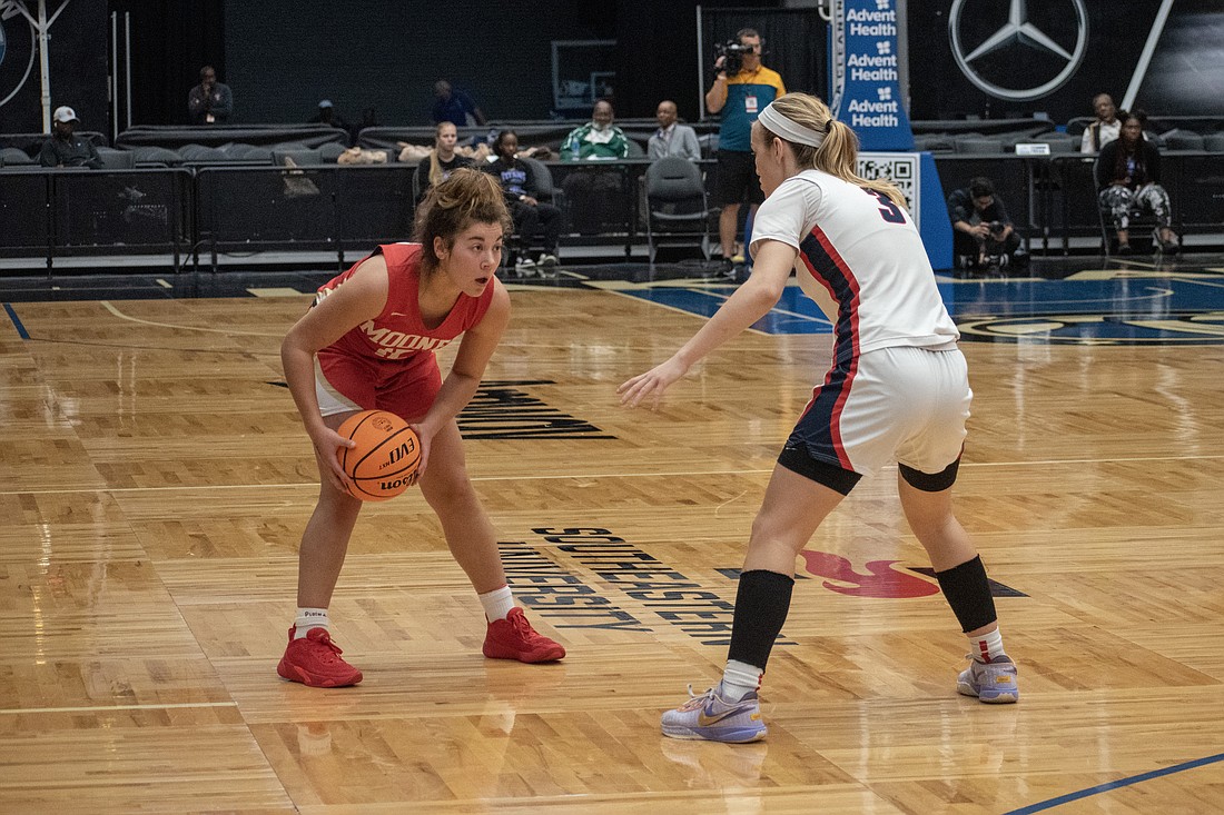 Mooney senior Olivia Davis goes one-on-one with Miami Country Day's Kristina Godfrey.