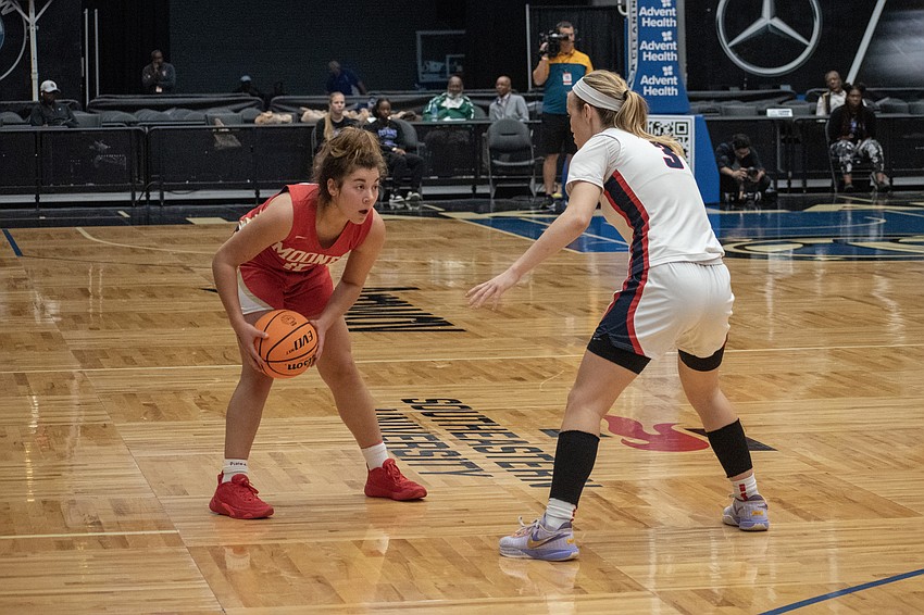 Mooney senior Olivia Davis goes one-on-one with Miami Country Day's Kristina Godfrey.