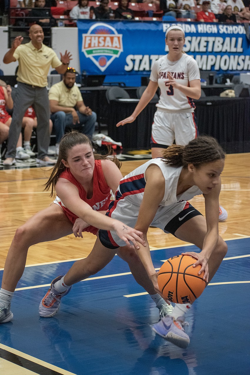 Mooney junior Sam Kotasek fights for a ball in the paint.