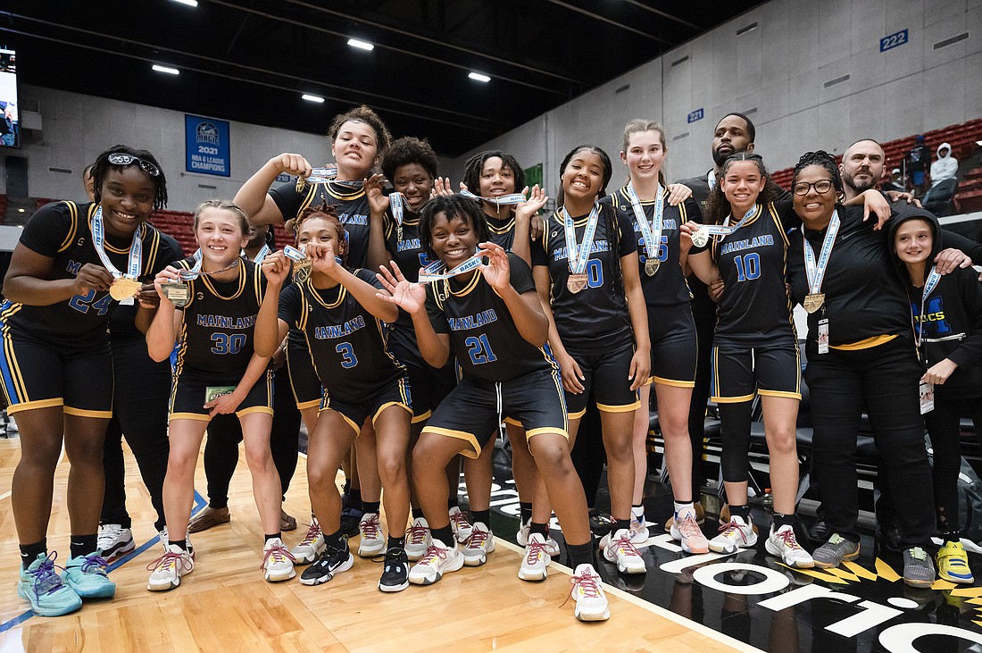 The Mainland girls basketball team wins the Class 5A state championship in Lakeland after beating American Heritage of Plantation 62-61. Photo by Michele Meyers