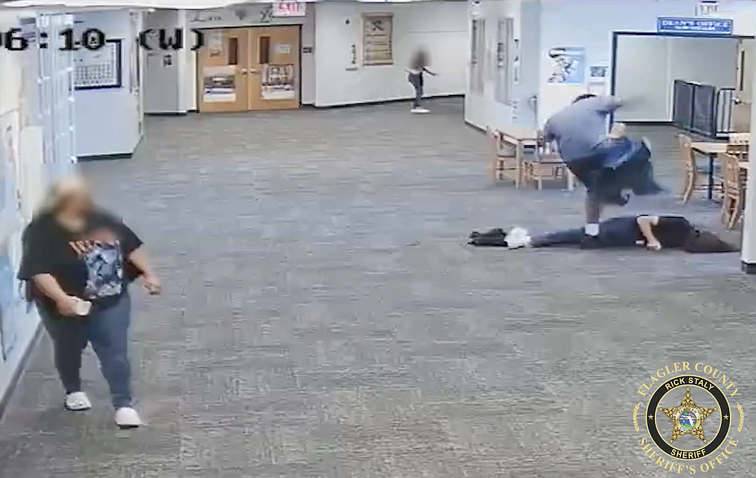 Surveillance video shows the student, 17, stomping on the back of a Matanzas High School paraprofessional after he knocked her unconscious. Image courtesy of the FCSO