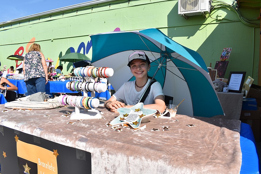 Ariel Rischer sells her handmade bracelets at the Young Entrepreneur Market at The Bazaar on Apricot & Lime.
