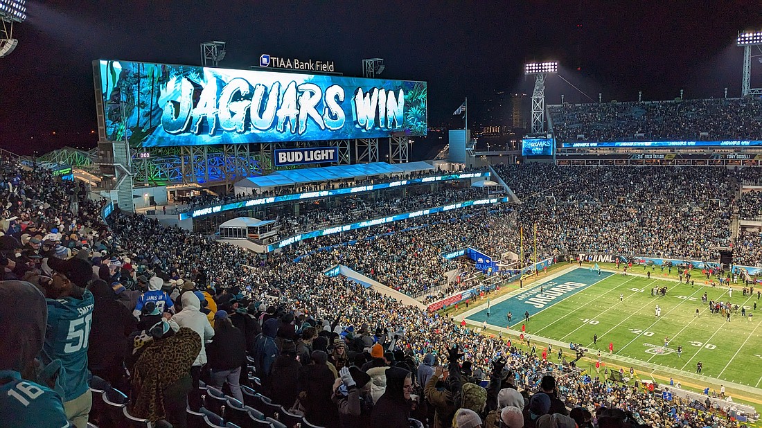 Fans celebrate after the Jacksonville Jaguars defeated the Los Angeles Chargers in the NFL playoffs 31-30 on Jan. 14 at TIAA Bank Field.