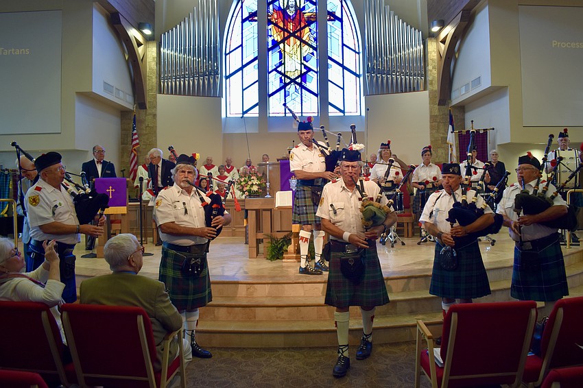 The Lion Rampant Pipe Band plays at Christ Church on Sunday.