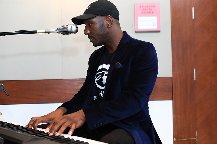 The artist Babyl sings out to the crowd.