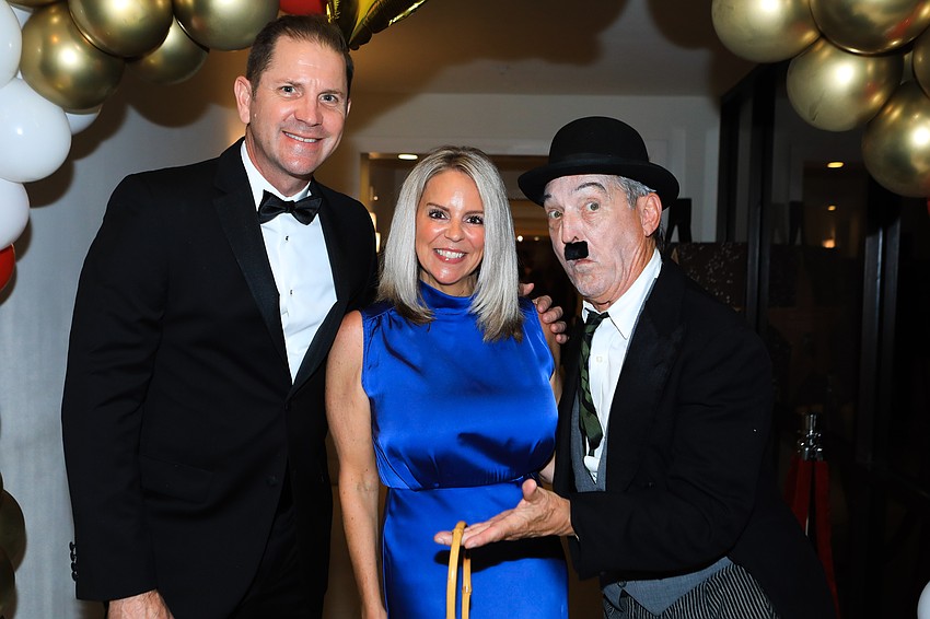 Brian and Jennifer Schulz with Kenney DeCamp as 