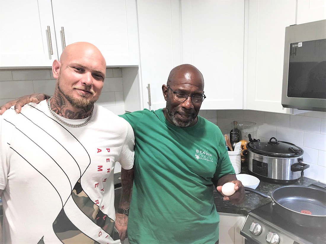 Two residents of a Project 180 home share breakfast cooking duties. The program received a donation of  $360,000 through a combination of grant funding and a low-interest loan from Community Foundation of Sarasota County to purchase its second home.
