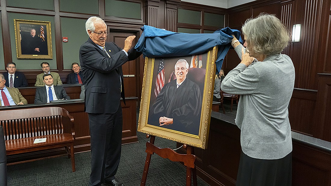 Duval County Judge Roberto Arias and his wife, Donna, unveiled his judicial portrait at a retirement ceremony Feb. 2 at the Duval County Courthouse.