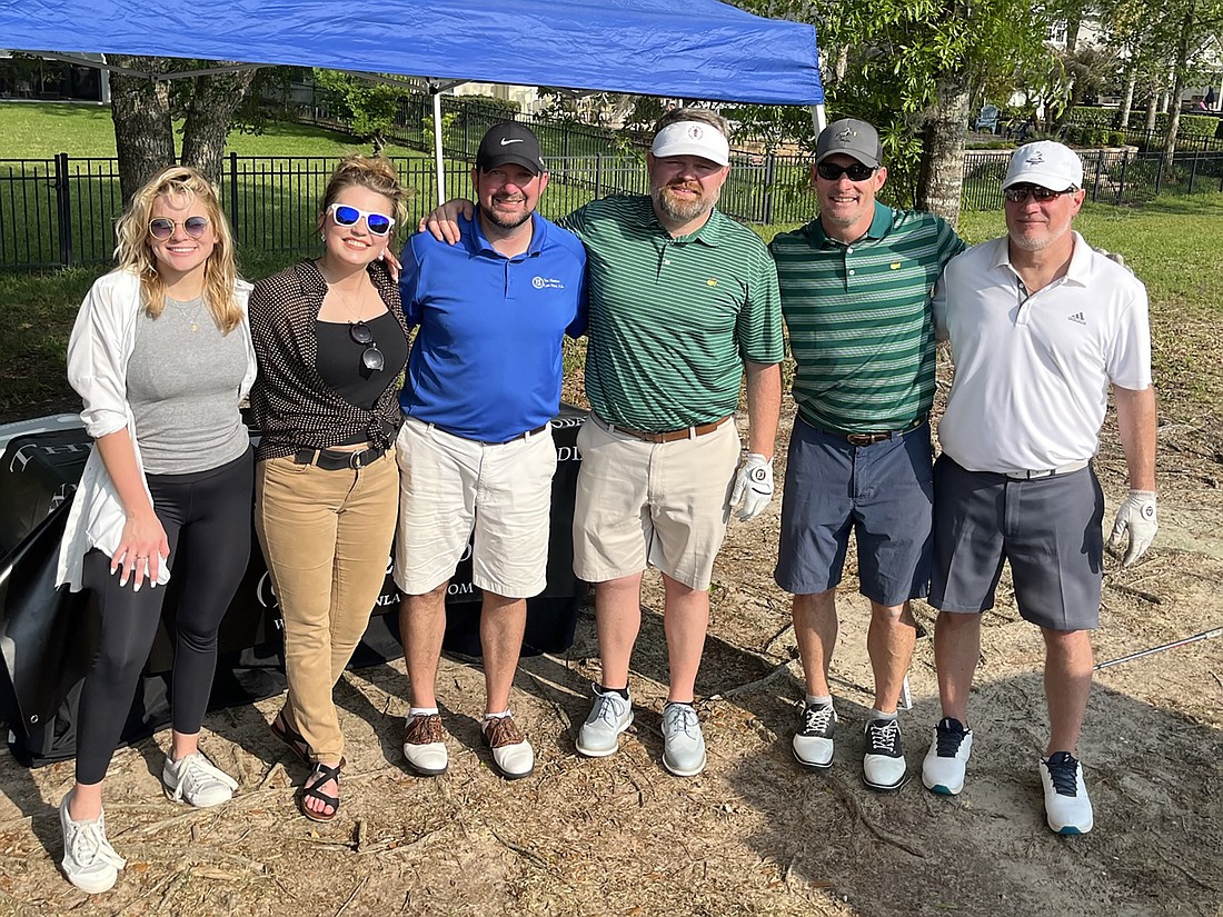 The 2022 Hinson Law Firm team, from left, event volunteers Amber Spearman Scire and Nancy Ewing with golf team members Matt Hinson, Chase Mills, Dan Dearing and David Dearing.