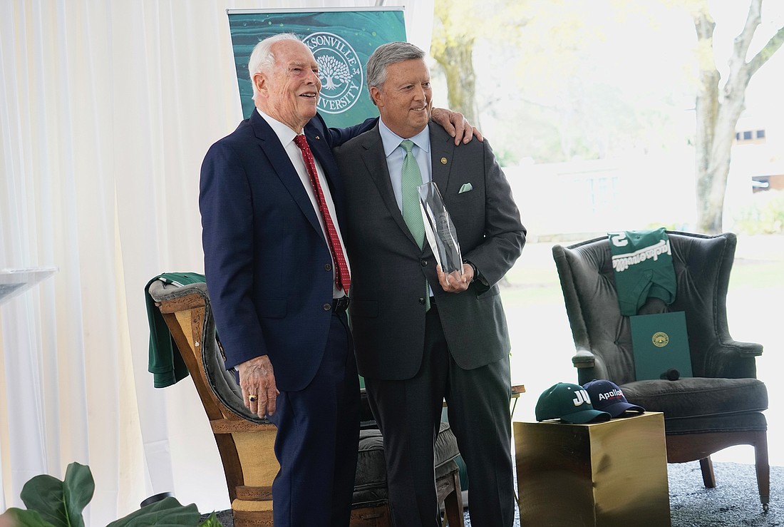 JU President Tim Cost presents retired Air Force Col. and astronaut David Scott with the the Jacksonville University Presidential Global Citizen Award at a Feb. 28 ceremony at JU’s Arlington campus.