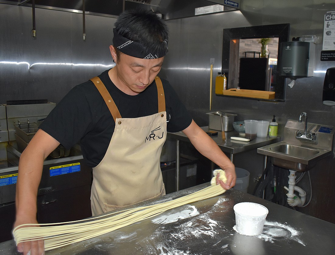 James Meng crafts hand-pulled noodles from scratch.