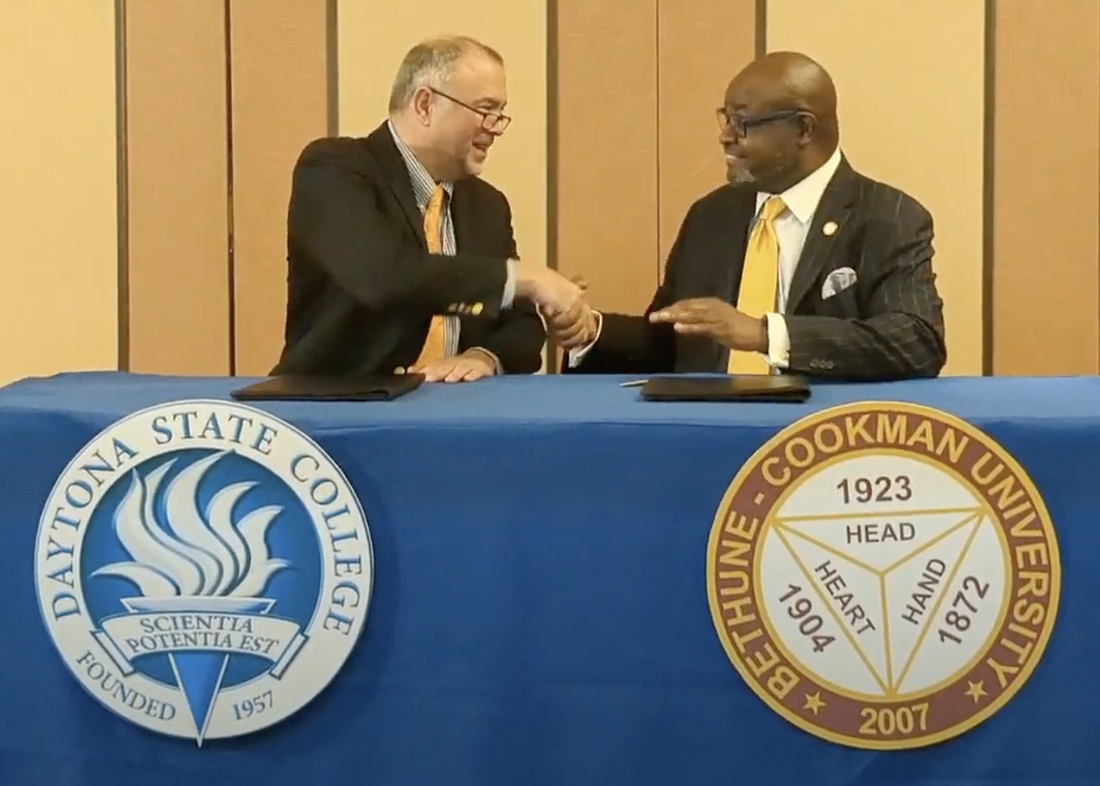 Daytona State College President Dr. Tom LoBasso and Bethune-Cookman University Interim President Dr. Lawrence Drake sign an articulation agreement supporting students pursuing careers in criminal justice. Courtesy photo