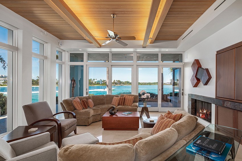 The first floor of the home has travertine floors and cypress ceilings.