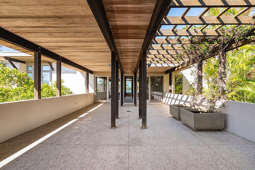 A 924-square-foot terrace overlooks the courtyard and pool.