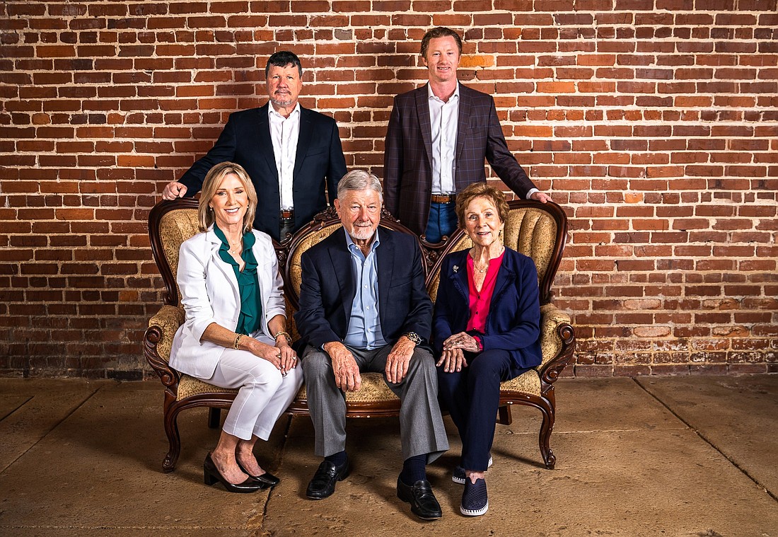 The Crews Banking Family is backed by four generations of leadership, including Chairman and CEO Jake Crews, top right. Next to Jake Crews is Chief Information Officer Mark Crews. Front row from left: bank director Dena Crews, Vice Chairman Bill Crews and Jeraldine Crews.
