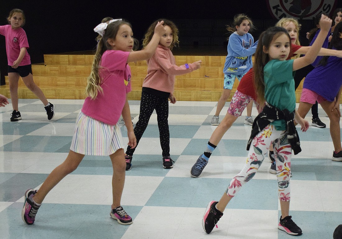 Tara Elementary's Mila Martinez and Ava Olivero dance in sync as they learn their new dance routine.
